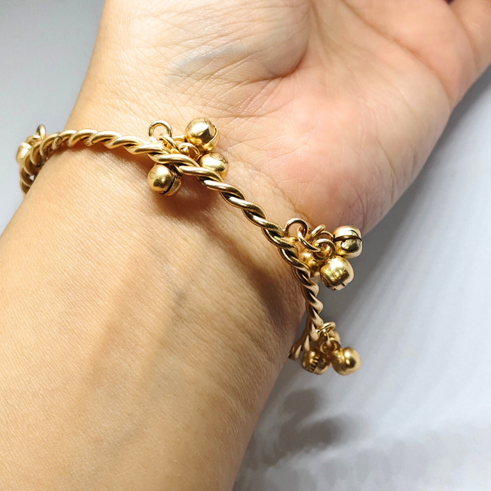 Gold-Toned Twisted Ghungroo Bangle